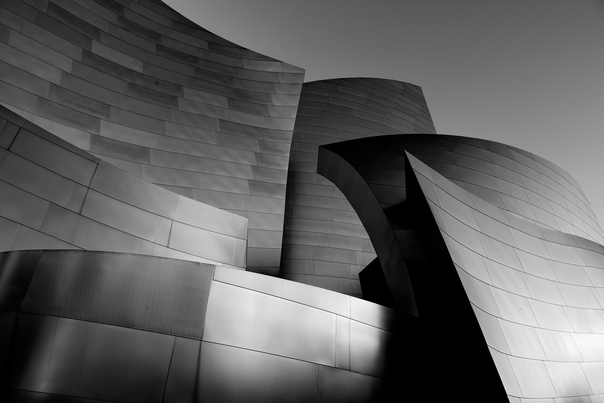 greyscale-shot-of-the-facade-of-modern-building-with-dark-grey-walls-1
